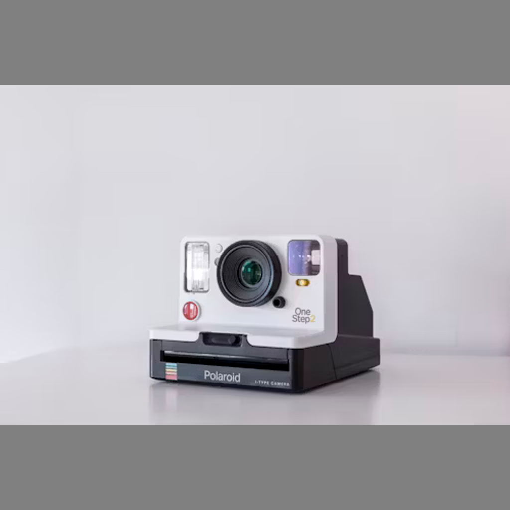 A young lady taking pictures at a party